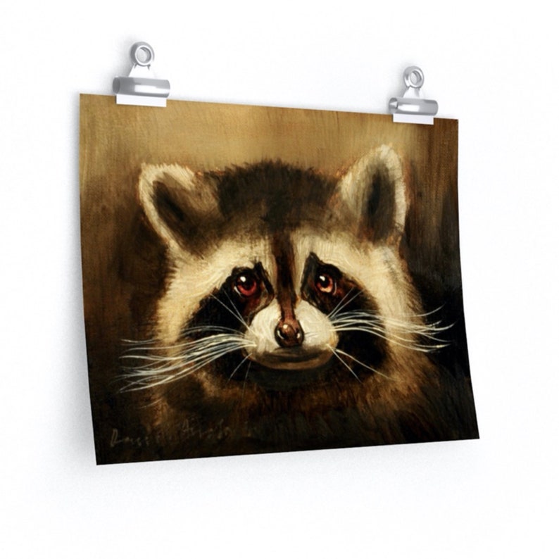 May include: A close-up portrait of a raccoon with dark brown fur, a black mask around its eyes, and a white nose. The raccoon's eyes are red and it has a slight smile on its face.