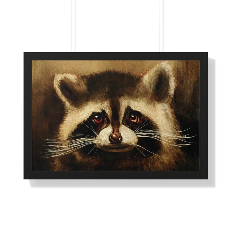 May include: A close-up portrait of a raccoon with dark brown fur, a white mask around its eyes, and red eyes. The raccoon is looking directly at the viewer with a slightly mischievous expression.