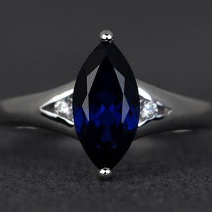 marquise cut blue sapphire ring engagement ring sterling silver women September birthstone ring blue gemstone ring three stone ring