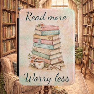 May include: A rectangular book-themed decorative item with the text "Read more Worry less". The image features a stack of books, a cup of coffee, and eyeglasses. The books are in pastel colors, and the background suggests a cozy library setting.