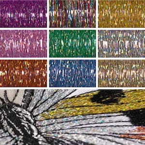 May include: A close-up of iridescent, holographic, metallic ribbon in various colours, including purple, green, blue, gold, and brown. The ribbon is arranged in rows, creating a shimmering, reflective effect.