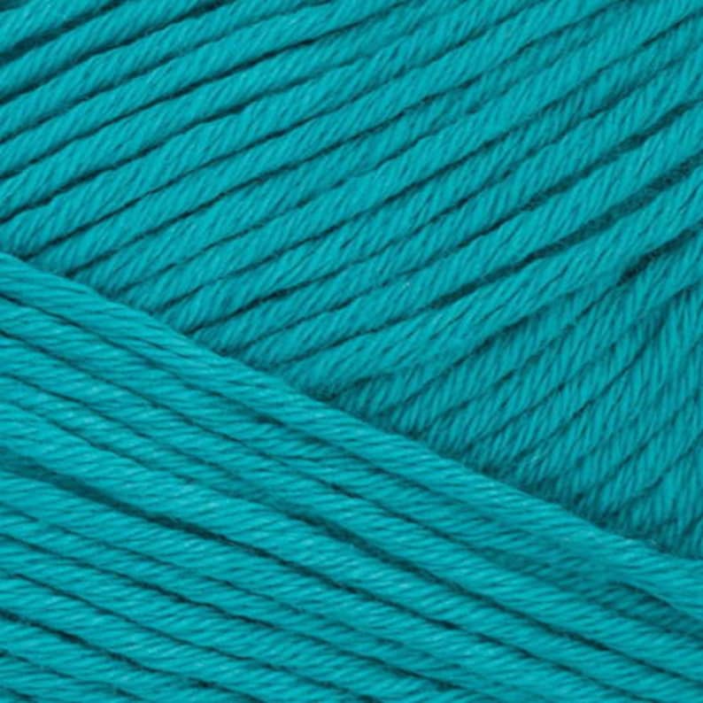 May include: Teal blue yarn skein, a close-up of the yarn showing the texture and color.