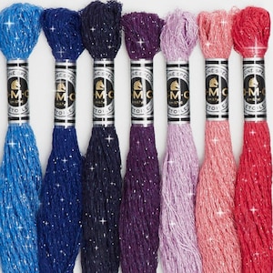 May include: Eight spools of sparkly embroidery floss in various colors, including blue, purple, pink, and red. Each spool has a label with the text "MC ONE SPEC" and a horse logo.