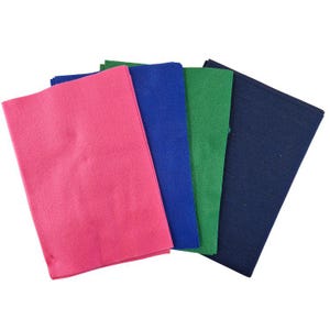 May include: A selection of rectangular felt sheets in pink, blue, green, and navy. The sheets are arranged to display their colours and texture. Suitable for various craft projects, these sheets are a versatile material.