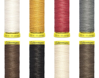 May include: Eight spools of Gütermann thread in various colours, including white, yellow, red, grey, brown, black, beige, and tan. Each spool is labelled with the brand name "Gütermann" and the length of the thread in metres and yards.