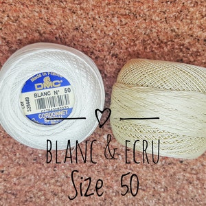 May include: Two spools of DMC embroidery floss, one white and one ecru, both labeled "BLANC N&deg; 50" and "CORDONNET SPECIAL".