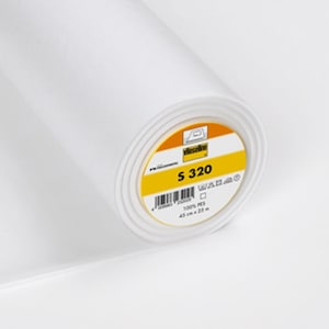 May include: A white roll of fusible interfacing with a yellow label that says "Vlieseline S 320 100% PES 45 cm x 25 m".