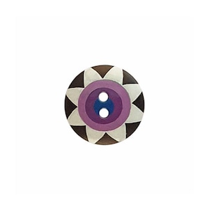 May include: A round, two-hole button featuring a dark brown outer edge, a white petal-like pattern, a lavender ring, and a dark blue center. The design is symmetrical, with the white petals radiating from the center toward the outer brown border.