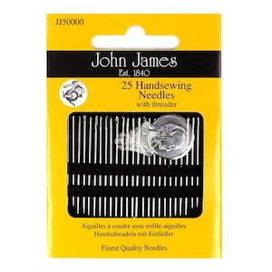 May include: A yellow and black package of 25 handsewing needles with a threader. The package has a silver John James logo with a dragon design. The text on the package reads "John James Est. 1840 25 Handsewing Needles with threader Finest Quality Needles".