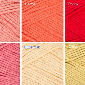 May include: Six skeins of yarn in different colors: coral, carrot, poppy, papaya, buttermilk, and citron.