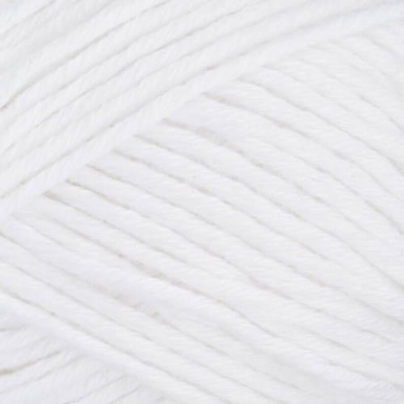 May include: A close-up of a ball of white yarn. The yarn is soft and fluffy, and it is perfect for knitting or crocheting.