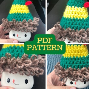 May include: A crochet elf hat pattern for a mug. The hat is green, yellow, and brown. The pattern is available as a PDF download.