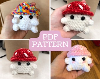 May include: Four crocheted mushroom plushies with different colored hats. The mushrooms are white with black eyes and a red, pink, rainbow, and red hat.
