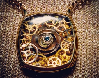 Gold Filled Vintage Watch Case Steampunk Pendant with Vintage watch parts and .05ct Blue Diamond