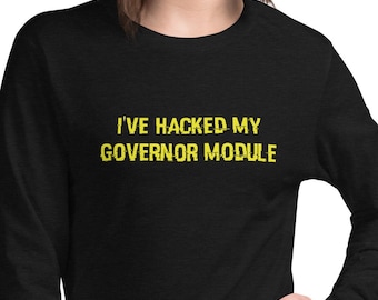May include: A black long-sleeved shirt with the text "I've hacked my governor module" in yellow.