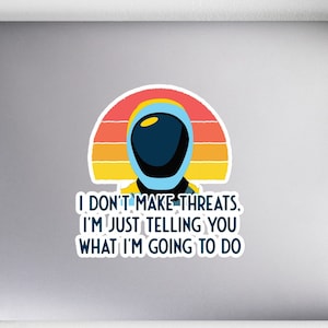 May include: A sticker with a retro sunset background and an astronaut wearing a blue helmet. The text reads "I don't make threats. I'm just telling you what I'm going to do."