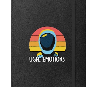 May include: Black notebook with a graphic of an astronaut helmet against a sunset background. The text "UGH...EMOTIONS" is below the astronaut. The notebook has a black elastic band closure.