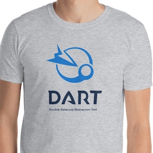May include: A gray t-shirt with a blue logo of a spacecraft and a planet. The text "DART" and "Double Asteroid Redirection Test" is printed below the logo.