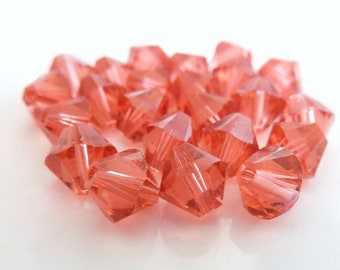 24pc Swarovski Crystal 5mm Padparadscha Bicone 5328 Beads; Pink-Orange
