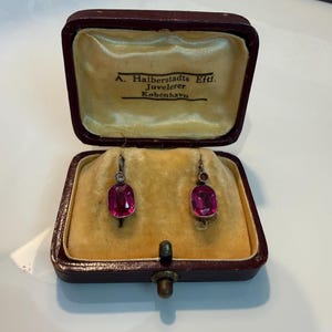 Antique 14k gold and silver earrings featuring synthetic rubies  hallmarks.