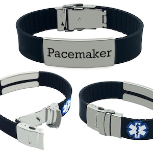Puede incluir: Pulsera de alerta médica de silicona negra con hebilla de acero inoxidable y una placa plateada que dice "Pacemaker".