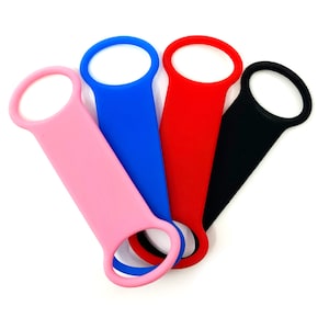 May include: Four silicone wristbands in pink, blue, red, and black. Each wristband has a small loop at the end.