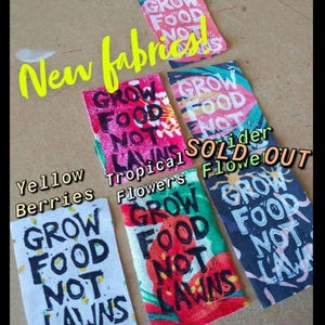 May include: Five fabric swatches with the text "Grow Food Not Lawns" printed on them. The swatches feature different designs, including yellow berries, tropical flowers, and a black and white design. The text "Sold Out" is written on the image.