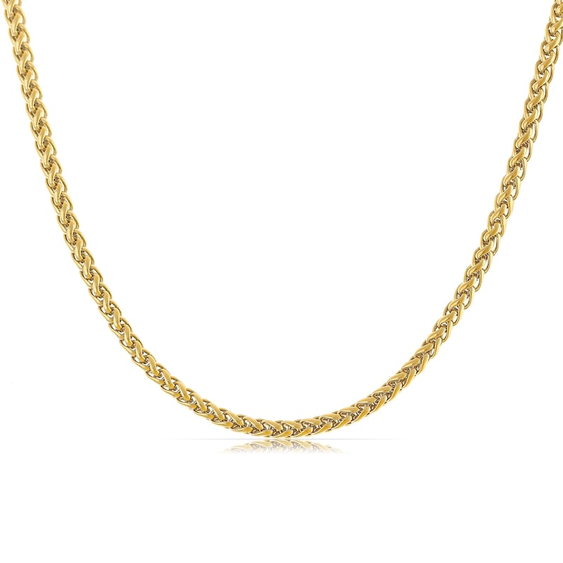 May include: A gold chain necklace with a wheat chain pattern.