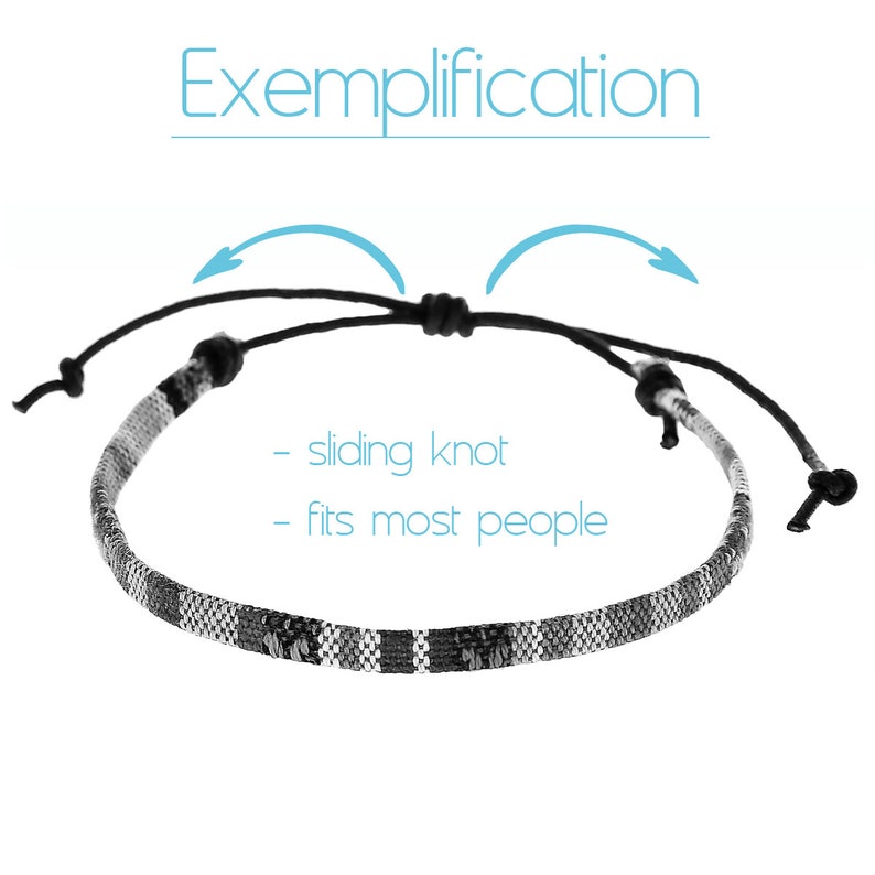 May include: A black and white woven bracelet with a sliding knot closure. The bracelet is adjustable to fit most people. "Exemplification" is written above the bracelet.