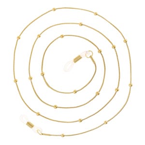 May include: A gold chain with small round beads, designed to hold glasses. The chain has two spring-loaded clasps for attaching to the temples of glasses.