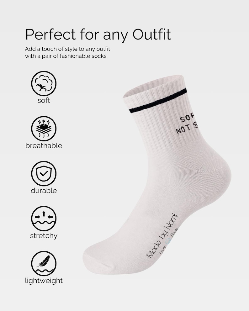 May include: White crew socks with a black stripe and the text "SOF NOTS" printed on the side. The socks are made by Nami and have the text "Live Free" printed on the bottom.
