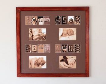 May include: A framed photo collage of a baby in various poses, with numbers and other details incorporated into the design. The frame is made of dark wood.