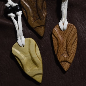 Wooden arrow-shaped pendants