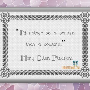 May include: Framed cross-stitch art with a quote by Mary Ellen Pleasant: "I'd rather be a corpse than a coward." The artwork features a decorative black border and the Industrious Owl logo. The background has a mosaic pattern.