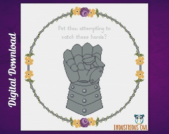 May include: Cross stitch pattern featuring a gray, armored fist with the text "Art thou attempting to catch these hands?" in a white circle surrounded by a green vine with yellow and purple flowers.