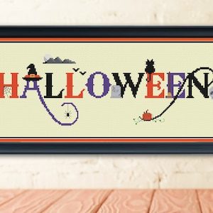 May include: Cross-stitch pattern featuring the word "HALLOWEEN" in colourful letters with various Halloween-themed imagery, including a witch's hat, a spider, a cat, a pumpkin, and a tombstone.