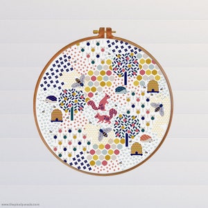 May include: A colourful cross-stitch pattern featuring a beehive, bees, squirrels, and trees. The pattern is stitched on white fabric and framed in a wooden hoop.