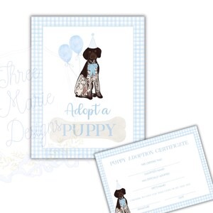 May include: A framed print and certificate featuring a watercolor illustration of a puppy wearing a party hat and bow tie, with blue balloons. The print has the text "Adopt a Puppy" on a bone-shaped design, set against a blue gingham background.