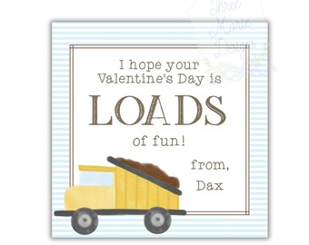 May include: Valentine's Day card with a yellow dump truck illustration. The card has a light blue striped background and a brown border. Text reads "I hope your Valentine's Day is LOADS of fun!" and "from, Dax."