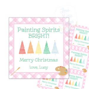May include: Christmas gift tags with a pink gingham border. The tags read "Painting Spirits BRIGHT!" and "Merry Christmas, love, Lucy." The design features colorful Christmas trees, a paintbrush, and a paint palette.
