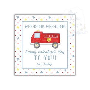 May include: Square Valentine's Day card with a red fire truck illustration. The card has the text "WEE-OOOH! WEE-OOOH!" and "happy valentine's day TO YOU! love, bishop". The border is white with blue stars, red dots, and yellow stars.