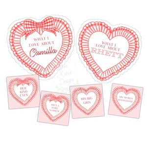 May include: A collection of red and white heart-shaped stickers. Two large stickers read "What I love about Camilla" and "What I love about Rhett." Smaller stickers say "Her kind eyes," "She's a hard worker," "His big grin," and "His sports knowledge."