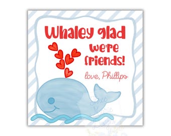 May include: Square card with a light blue whale illustration, red hearts, and the text "Whaley glad we're friends!" in red. The card has a blue and white striped border and the words "love, Phillips".