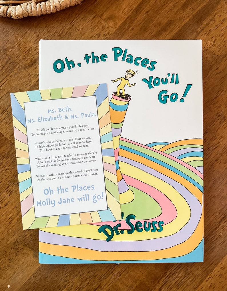 May include: A colorful book titled "Oh, the Places You'll Go!" by Dr. Seuss. A smaller card with a message thanking teachers for their work and a personalized message for a student named Molly Jane is placed on top of the book.