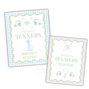 May include: Two welcome signs for a golf-themed birthday party. The sign on the left is blue and white gingham with the text "Welcome to Tanner's 1st Birthday Par-Tee!" The sign on the right is pink and white gingham with the text "Welcome to Palmer's Par-Tee!"