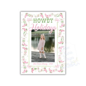 May include: A holiday card with a photo of a young person in a pink dress. The card features a border of pink and green cowboy boots and the words "Howdy Holidays" in green and pink. The text "The Carter Family - 2025" is at the bottom.