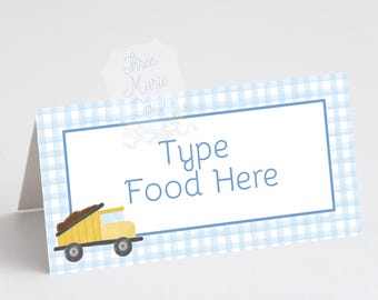 May include: A light blue gingham patterned table tent card with a white center and blue border. The text "Type Food Here" is in blue script. A yellow truck graphic is on the left. The card has a small tab with the text "Three Marie Designs".
