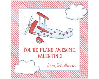 May include: A Valentine's Day card featuring a light blue airplane decorated with red hearts. The card has a red and white striped border and includes the text "YOU'RE PLANE AWESOME, VALENTINE!" and "love, Rhettman". Two white clouds are also included.