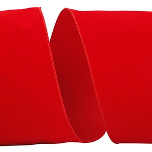 May include: A roll of bright red velvet ribbon. The ribbon is 2.5 inches wide and has a satin edge.