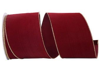 May include: A spool of red velvet ribbon with a gold edge. The ribbon is 2.5 inches wide.